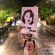 A protester walks toward Portland police with a sign honoring Breonna Taylor on September 23, 2020 in Portland, United States.